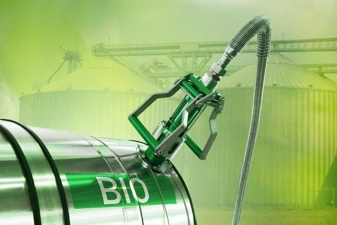 A green biofuel tank and a hose
